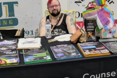  Prism Counseling giving information on mental health resources to LGBTQ  crowd