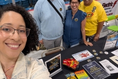 Kira Maddox, NAACP volunteer, Kristen Rasmussen, NAACP Freedom Fund Dinner Chairperson and Jennifer Woodman give civil rights information and membership forms to residents at vendor booths 